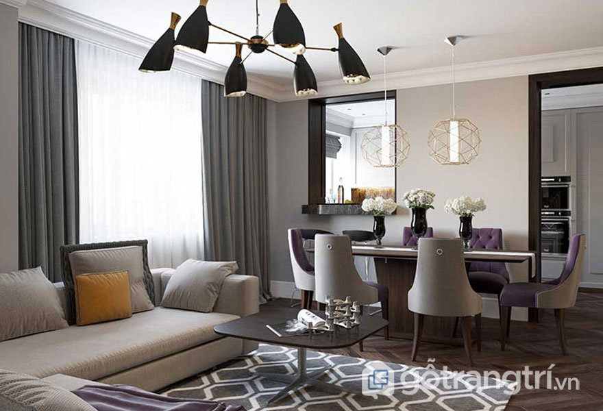 Sàn gỗ bóng kết hợp thảm trải hình học làm nổi bật thiết kế Art Deco cho phòng khách (Ảnh: Internet)
