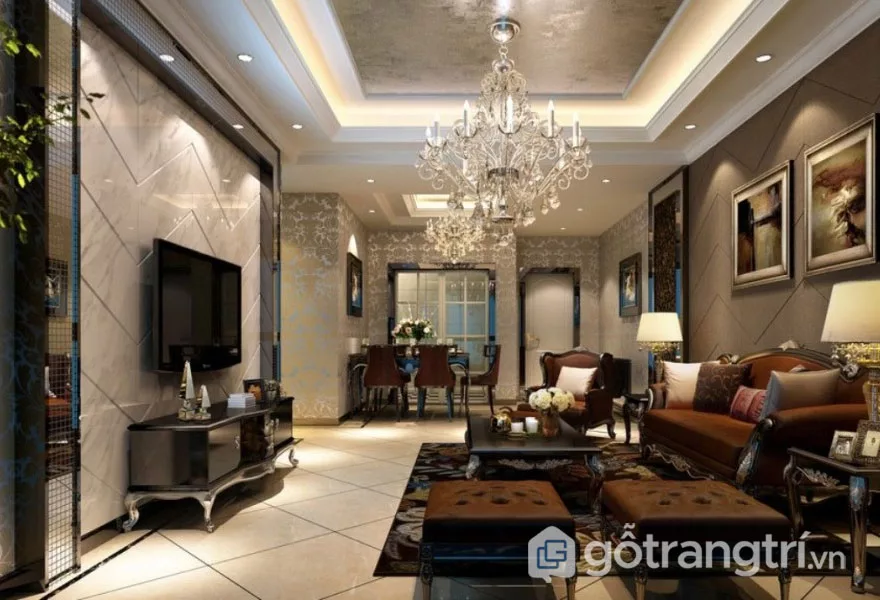 Nhà phong cách tân cổ điển được trang trí nổi bật đèn chùm pha lên và tone màu nâu trầm (Ảnh: Internet)